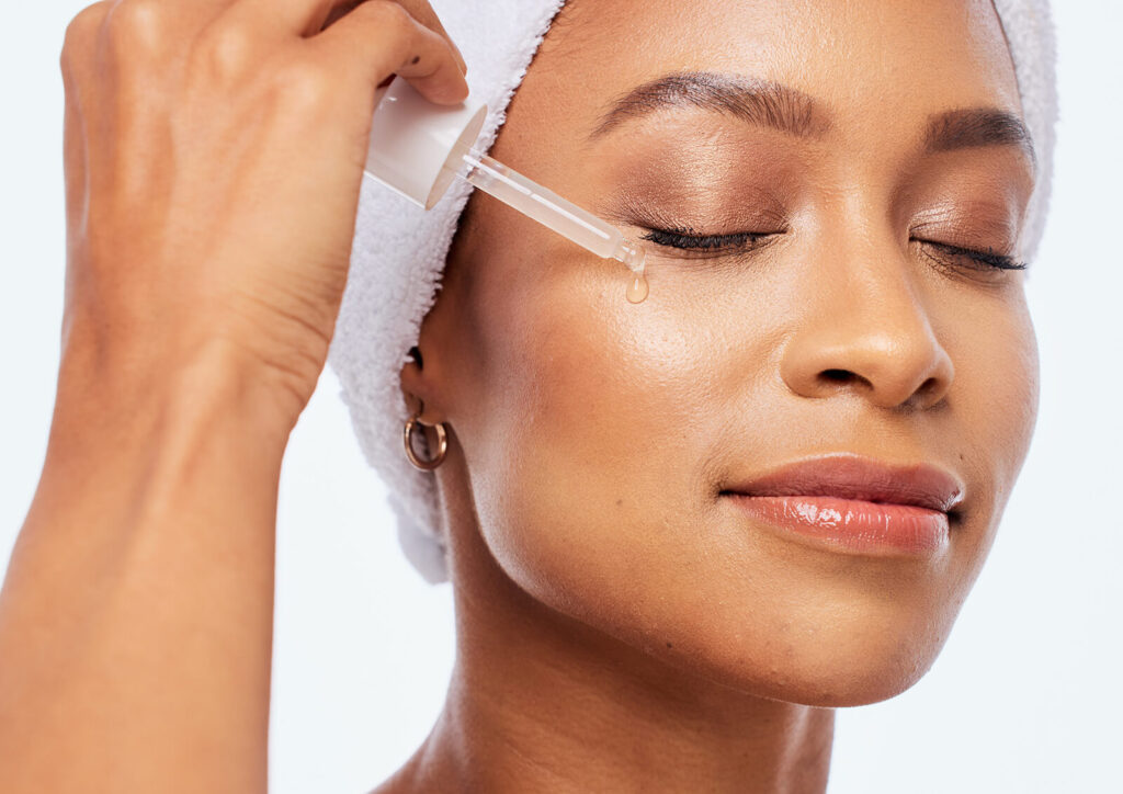 Woman following a customized medical-grade skincare routine at home after consultatio