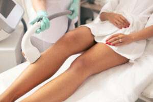 Laser hair removal treatment on a woman’s legs for long-lasting smooth skin at Skin Luxe Medical Aesthetics