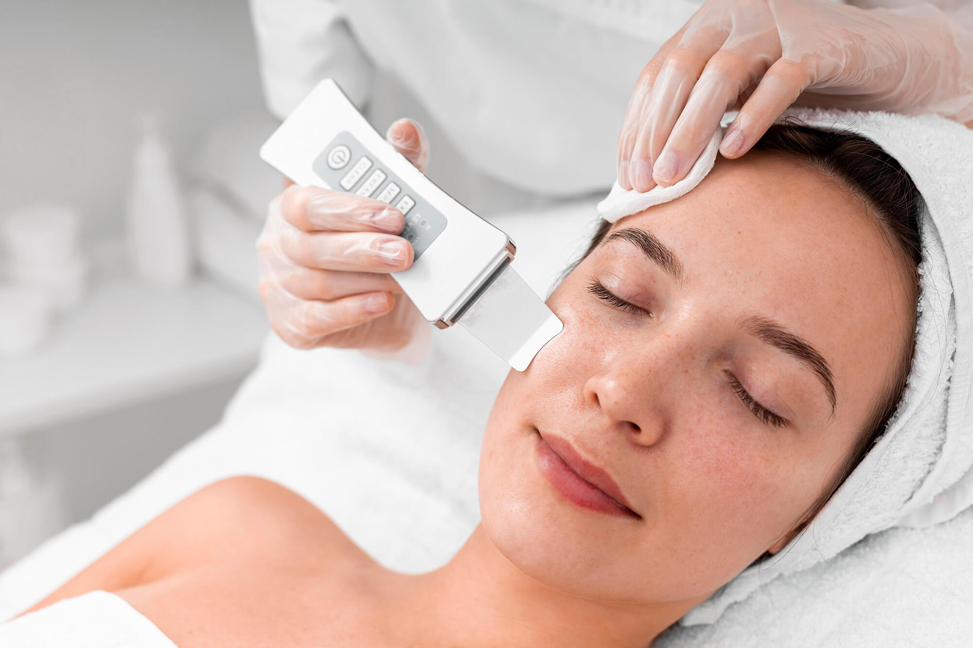 Woman applying medical-grade skincare products recommended by Skin Luxe professionals