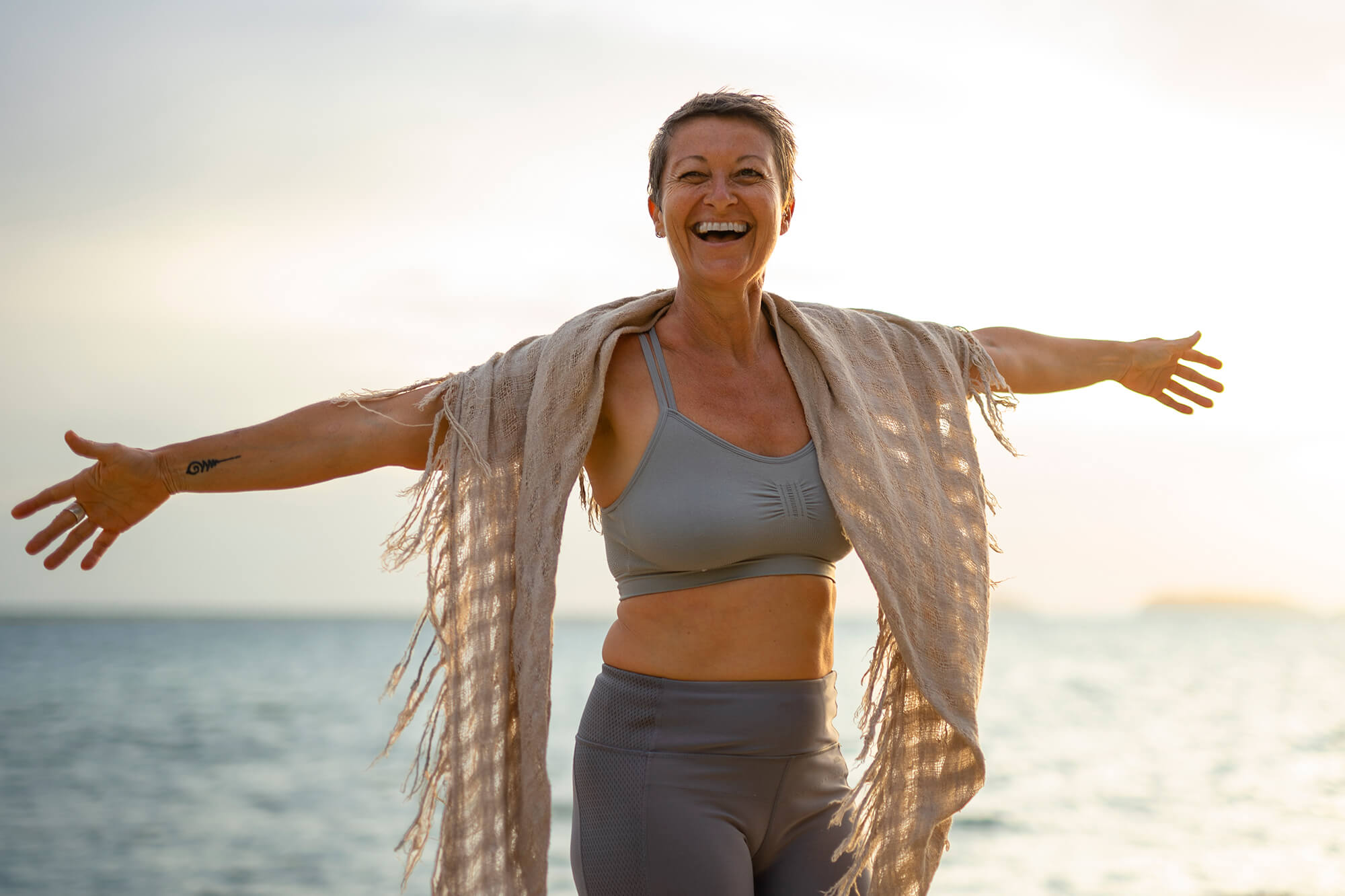 Healthy, active woman benefiting from balanced hormones through HRT at Skin Luxe