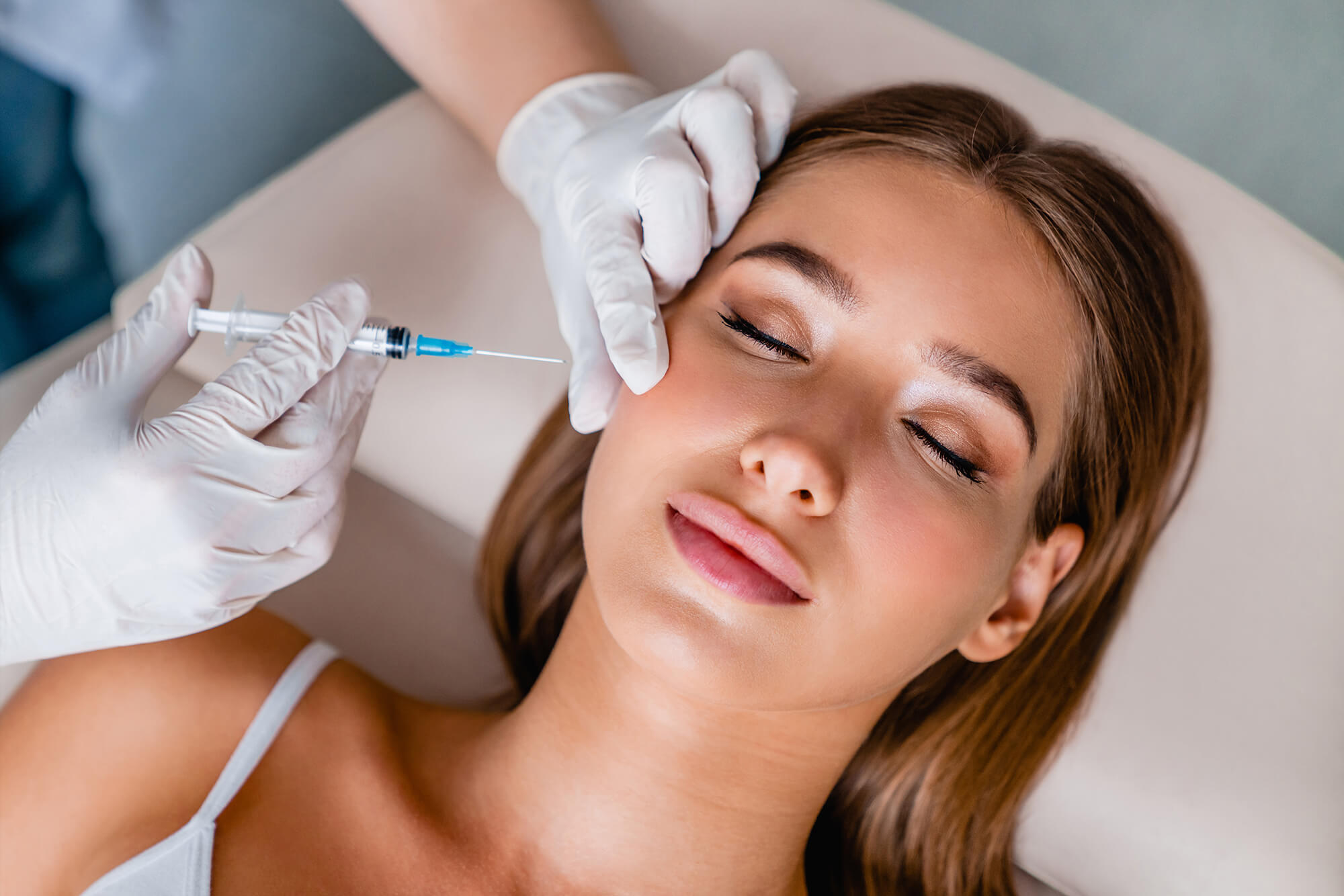 Professional applying Daxxify injectable for smoother skin